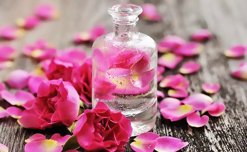 Premium BiBi Food Rose Water in an elegant glass bottle, showcasing its clear, pure liquid with a hint of natural pink hue, perfect for culinary and skincare uses